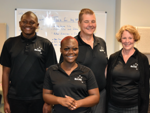 (Left to right) Apprentices Arthur Gibson and Patrice Fountain with CEO Rodney McLeod and President and Co-Founder Debbie McLeod
