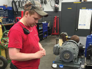 Apprentice Dylan Lowe working in the machine shop
